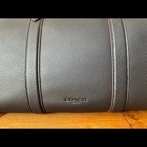 Brand new, unopened/untouched luxury Coach "Metropolitan Soft Duffle" bag.